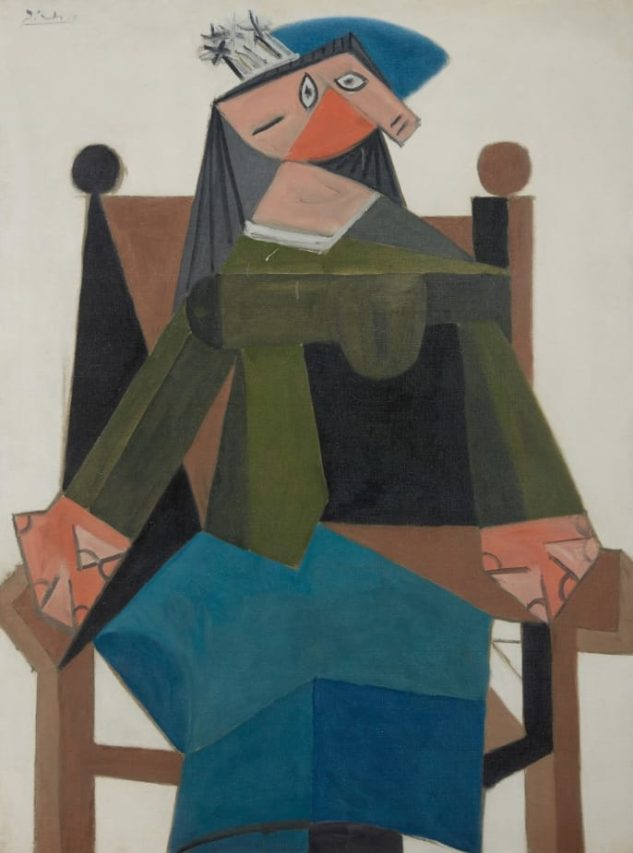 “Mujer sentada en un sillón”, obra realizada por Picasso.